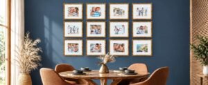 Modern dining room with a navy blue accent wall, gold-framed family photo gallery, round wooden dining table, warm brown chairs, dried flowers, and natural decor.