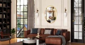 Modern living room with a round wall mirror above a leather sofa.