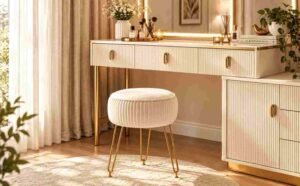 Budget Bedroom Makeover with a stylish cream vanity and accent stool.