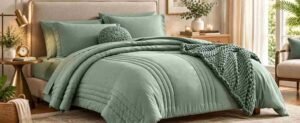 Budget Bedroom Makeover with a cozy sage green bedding set, textured throw, warm wood furniture, soft lighting, and natural decor for a stylish bedroom refresh.