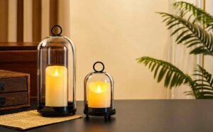 Home Decor Finds Under $50 featuring two glowing glass candle holders.
