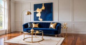 Elegant navy velvet sofa and gold accents featuring luxury living room ideas for a sophisticated interior.
