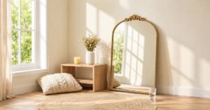 Gold mirror and natural wood table among luxury living room items.